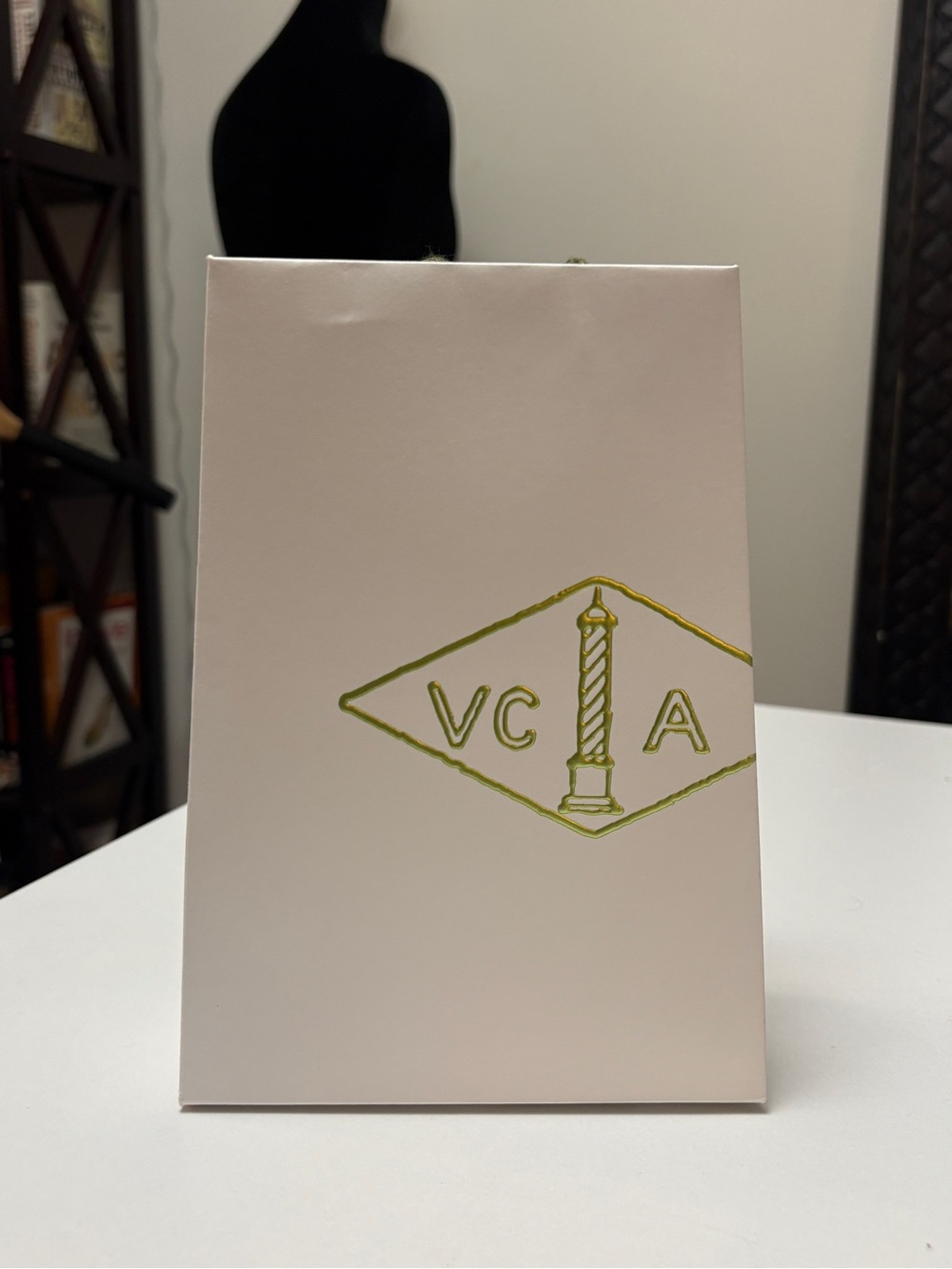 Embossed White Van Cleef & Arpels Gift Bag with Gold Logo. 5.5”x2.5”x7.75”